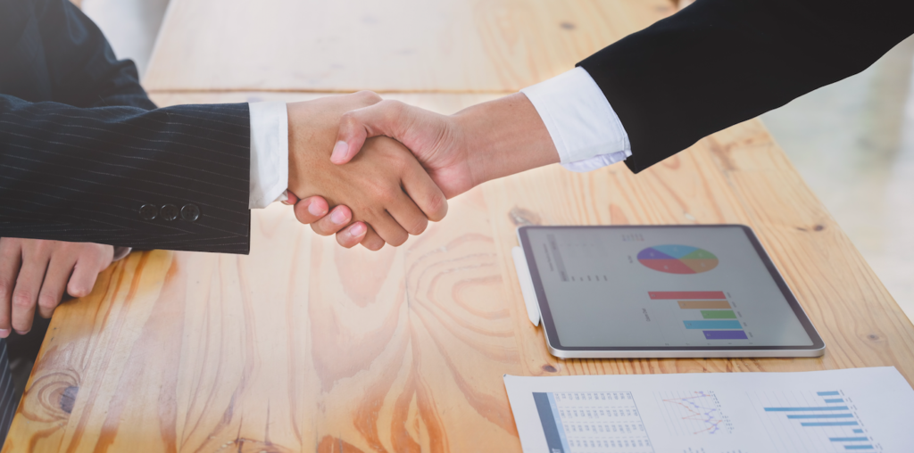 Handshake over a table